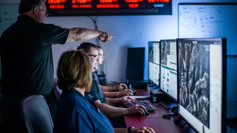 Staff working in a mission operations center.