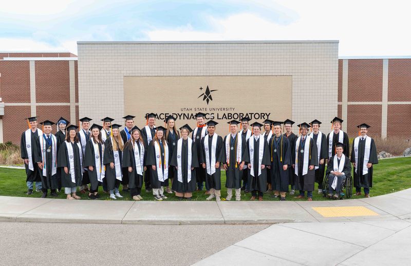Graduating student employee pose at SDL.