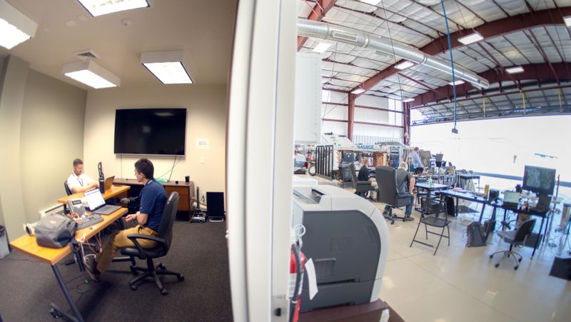 Engineers performing analysis inside SDL's hangar.