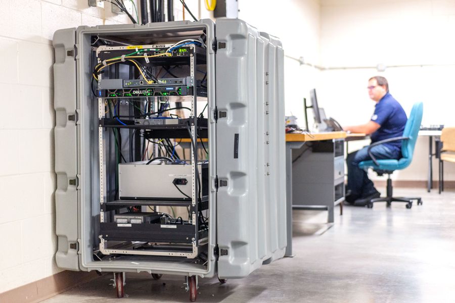 An engineer working on a computer in the datacenter laboratory.