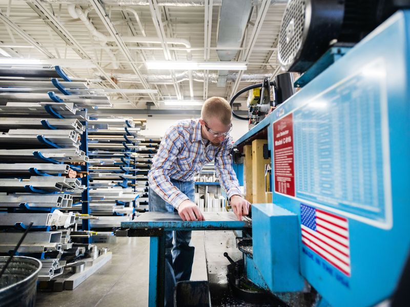 A person working in a manufacturing shop.