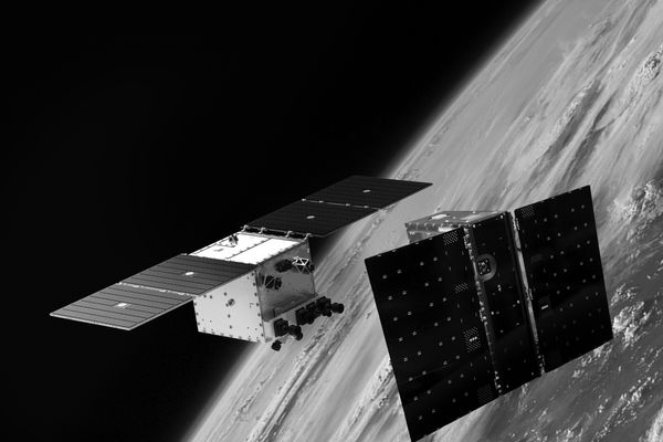Two satellites performing a rendezvous, proximity operations, and docking maneuver.