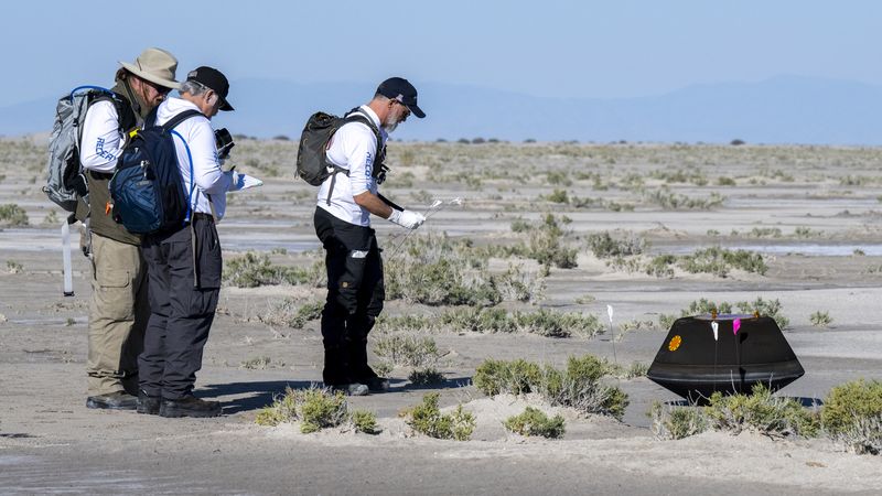 From left to right, NASA Astromaterials Curator Francis McCubbin, NASA Sample Return Capsule Science Lead Scott Sandford, and University of Arizona OSIRIS-REx Principal Investigator Dante Lauretta, collect science data, Sunday, Sept. 24, 2023, shortly after the sample return capsule from NASA’s OSIRIS-REx mission landed at the Department of Defense's Utah Test and Training Range. The sample was collected from the asteroid Bennu in October 2020 by NASA’s OSIRIS-REx spacecraft. (Photo Credit: NASA/Keegan Barber)