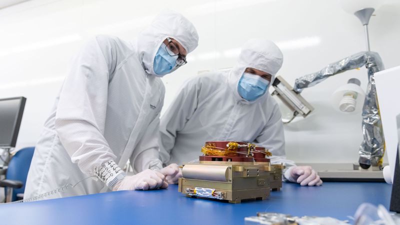 SDL engineers are pictured inspecting the two completed Carruthers ultraviolet cameras before they undergo environmental testing at SDL facilities.