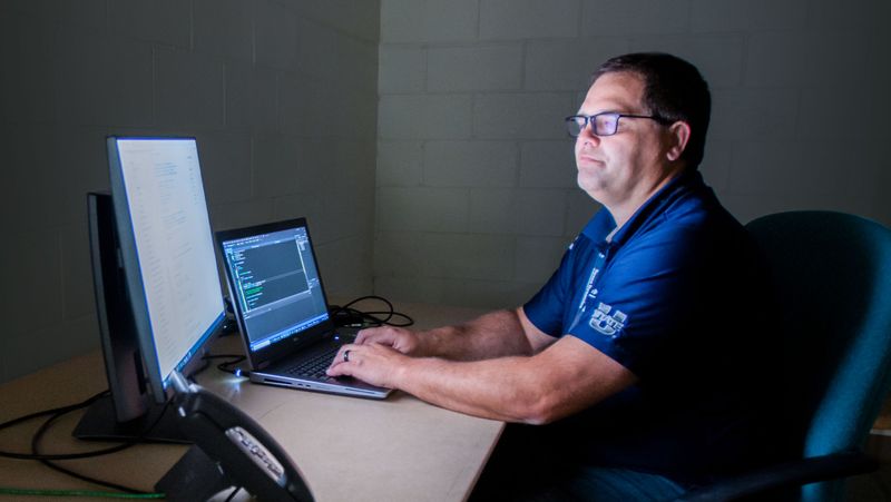 An engineer working at a computer.