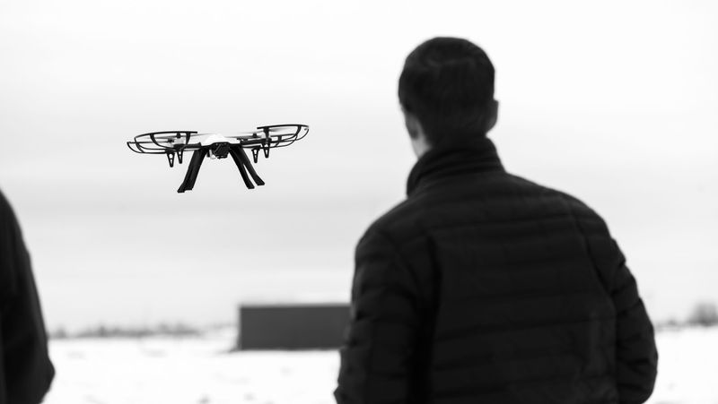 An engineer flying a quadcopter.