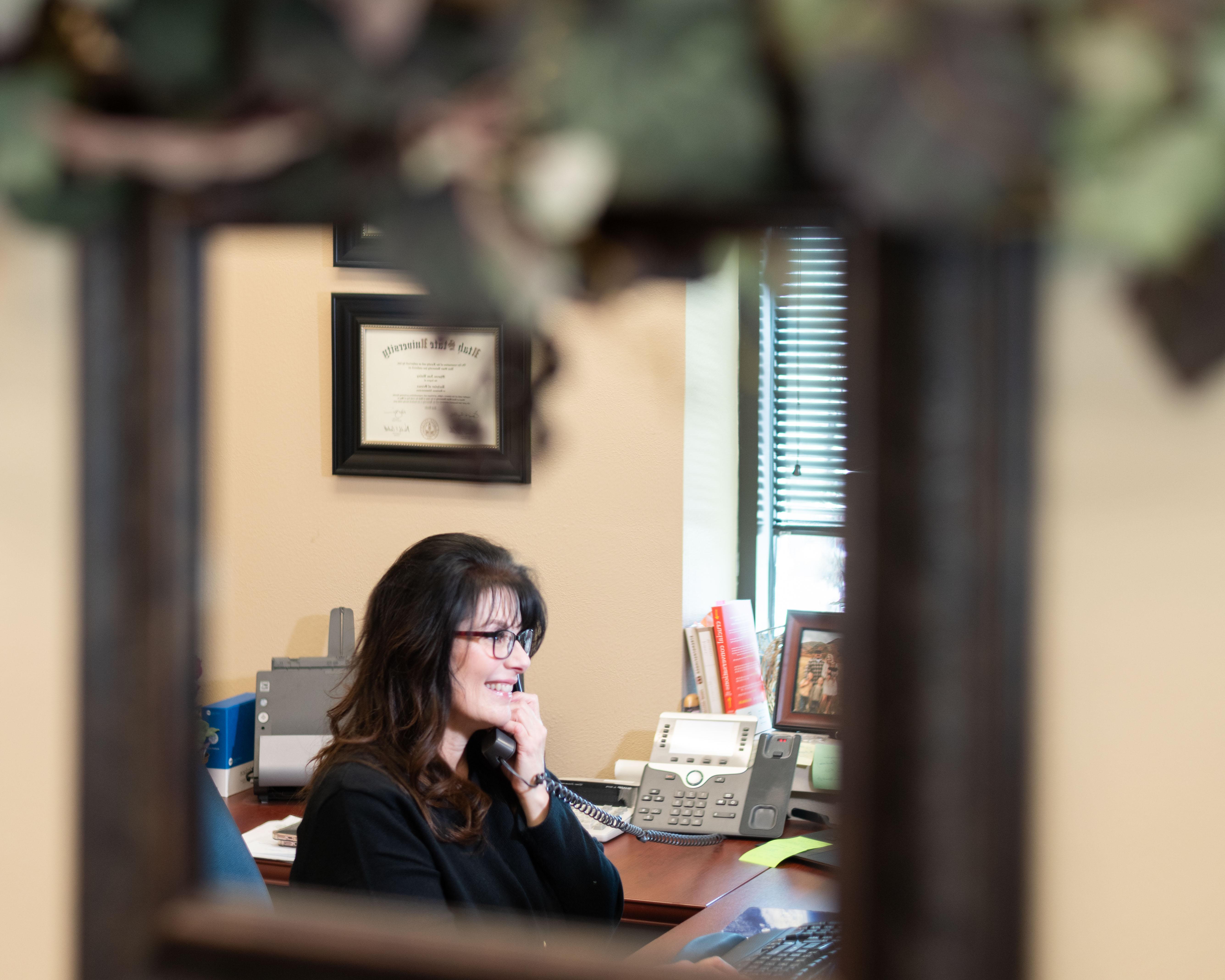 Sharon Hensley works at her desk.