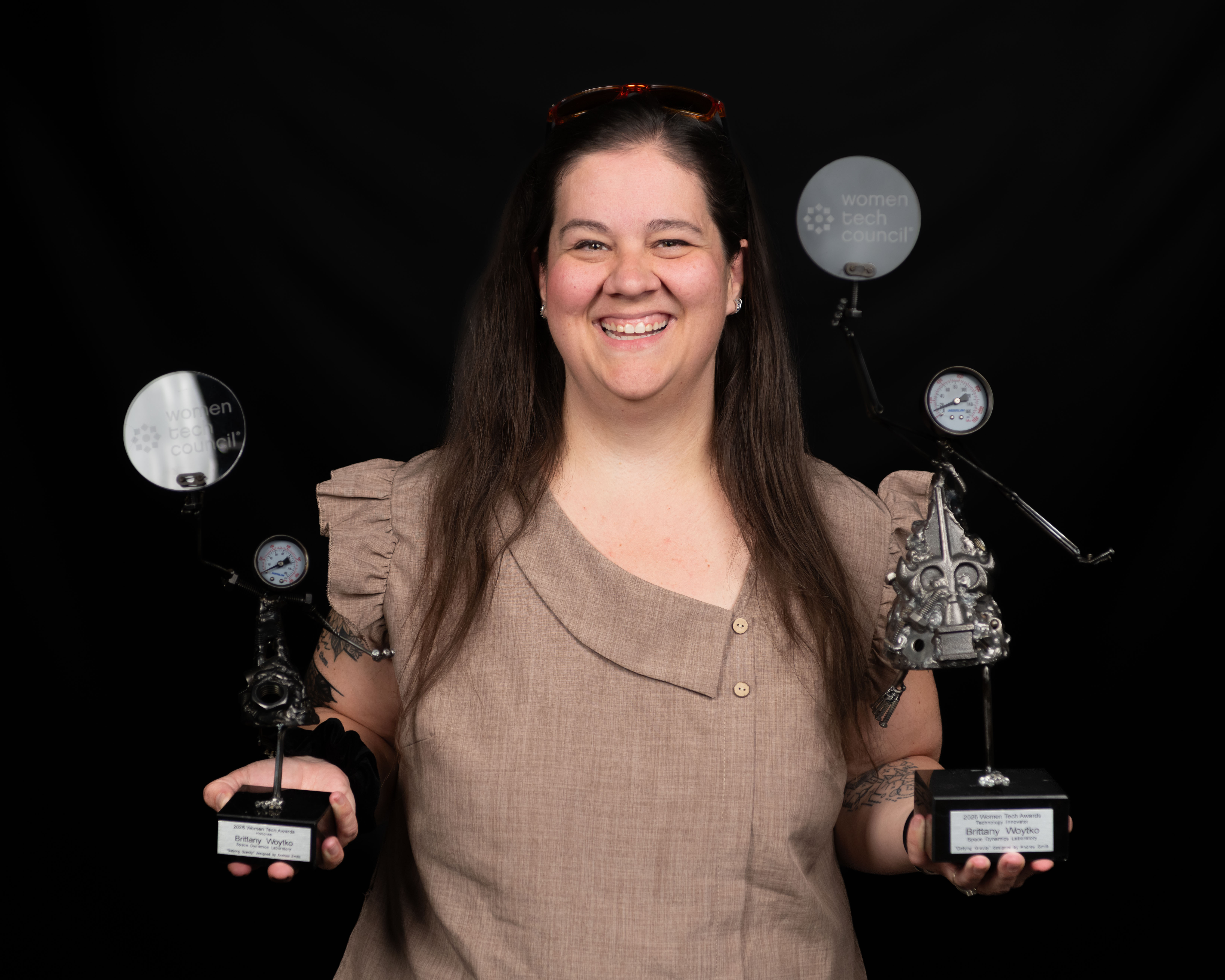 SDL's Brittany Woytko with her women in technology trophys.